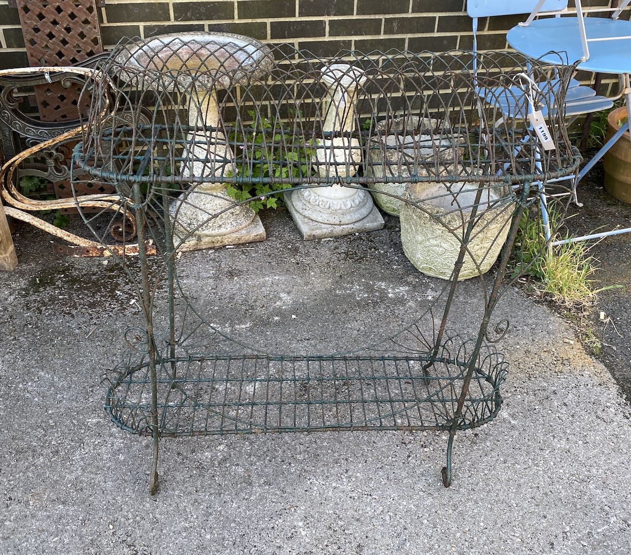 A Victorian style two tier wire-work pot stand, width 92cm, height 95cm